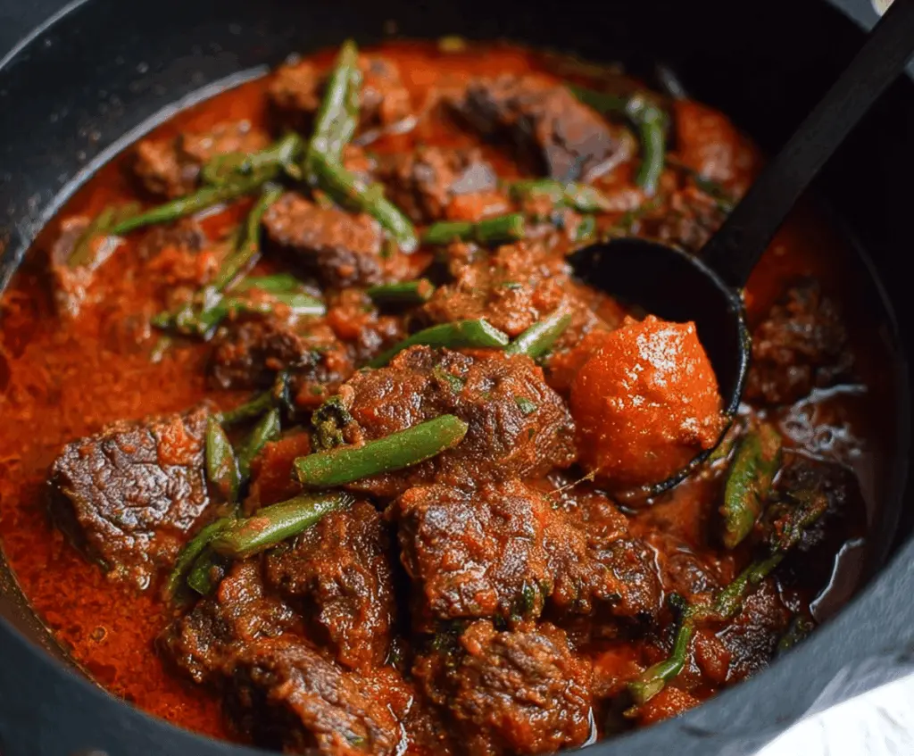 Delicious Nigerian Beef Stew with tender beef chunks, vibrant tomatoes, and flavorful spices served in a bowl