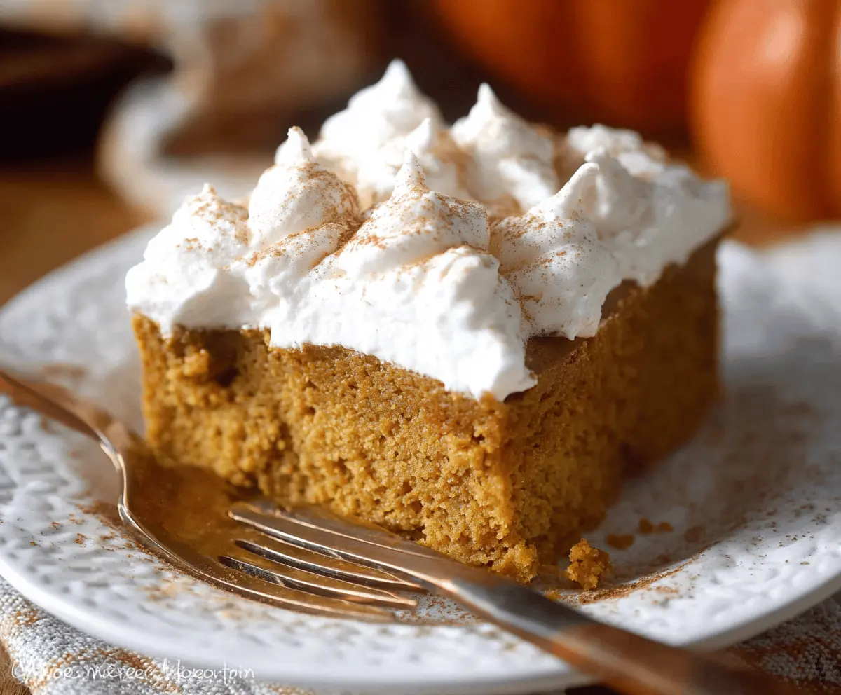 Delicious pumpkin three-ingredient cake with creamy frosting on a serving plate, perfect for fall desserts