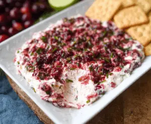 Creamy Cranberry Jalapeño Cream Cheese Dip with fresh cranberries and sliced jalapeños for snacking.