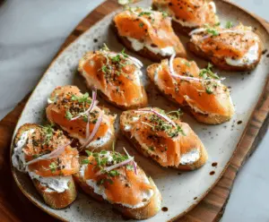 Delicious smoked salmon crostini with fresh herbs served on a wooden platter