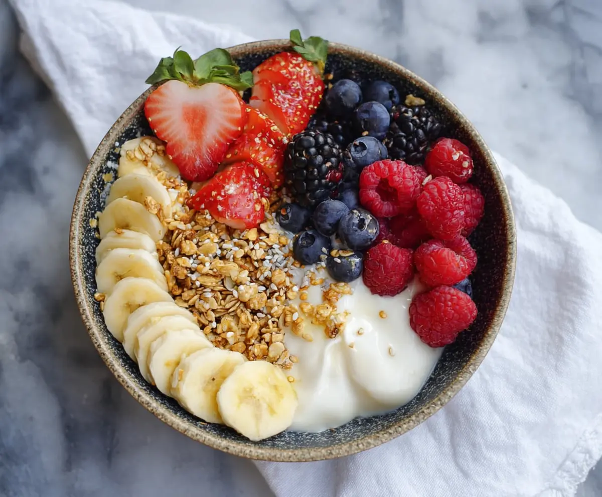 Healthy Greek Yogurt Protein Bowl topped with fresh fruits and nuts for a nutritious breakfast.