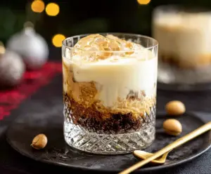 Festive Peanut Butter White Russian Christmas Cocktail served in a glass with holiday decor
