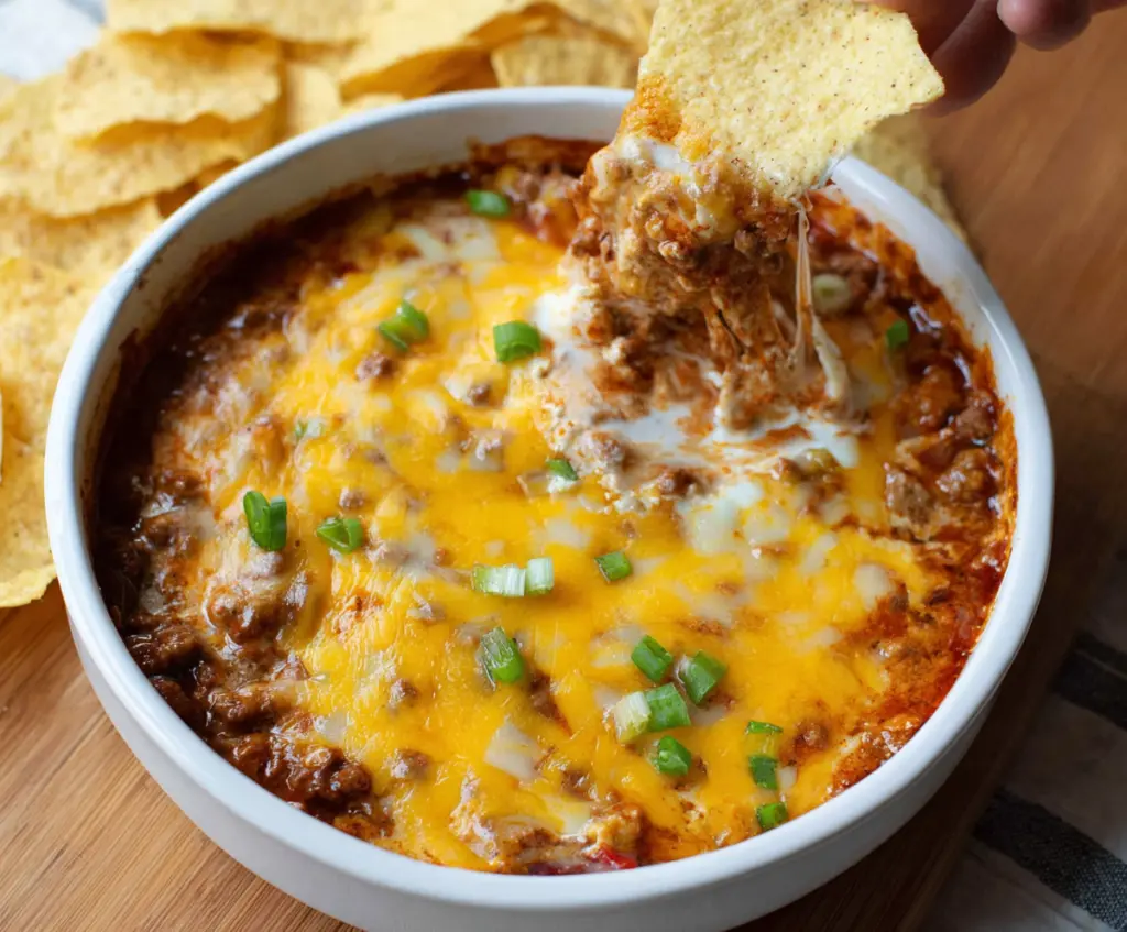 Cream Cheese Chili Dip served with nachos, perfect for parties and gatherings.