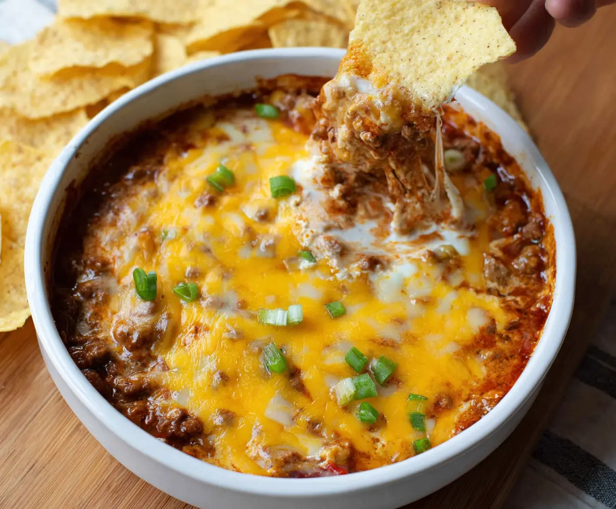 Cream Cheese Chili Dip served with nachos, perfect for parties and gatherings.