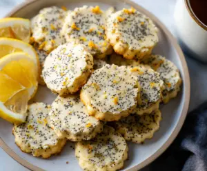Delicious Lemon Poppy Seed Cookies on a plate, showcasing bright yellow citrus flavor and poppy seeds.