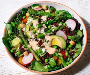 Fresh Spring Chopped Salad with vibrant vegetables and herbs, served in a bowl